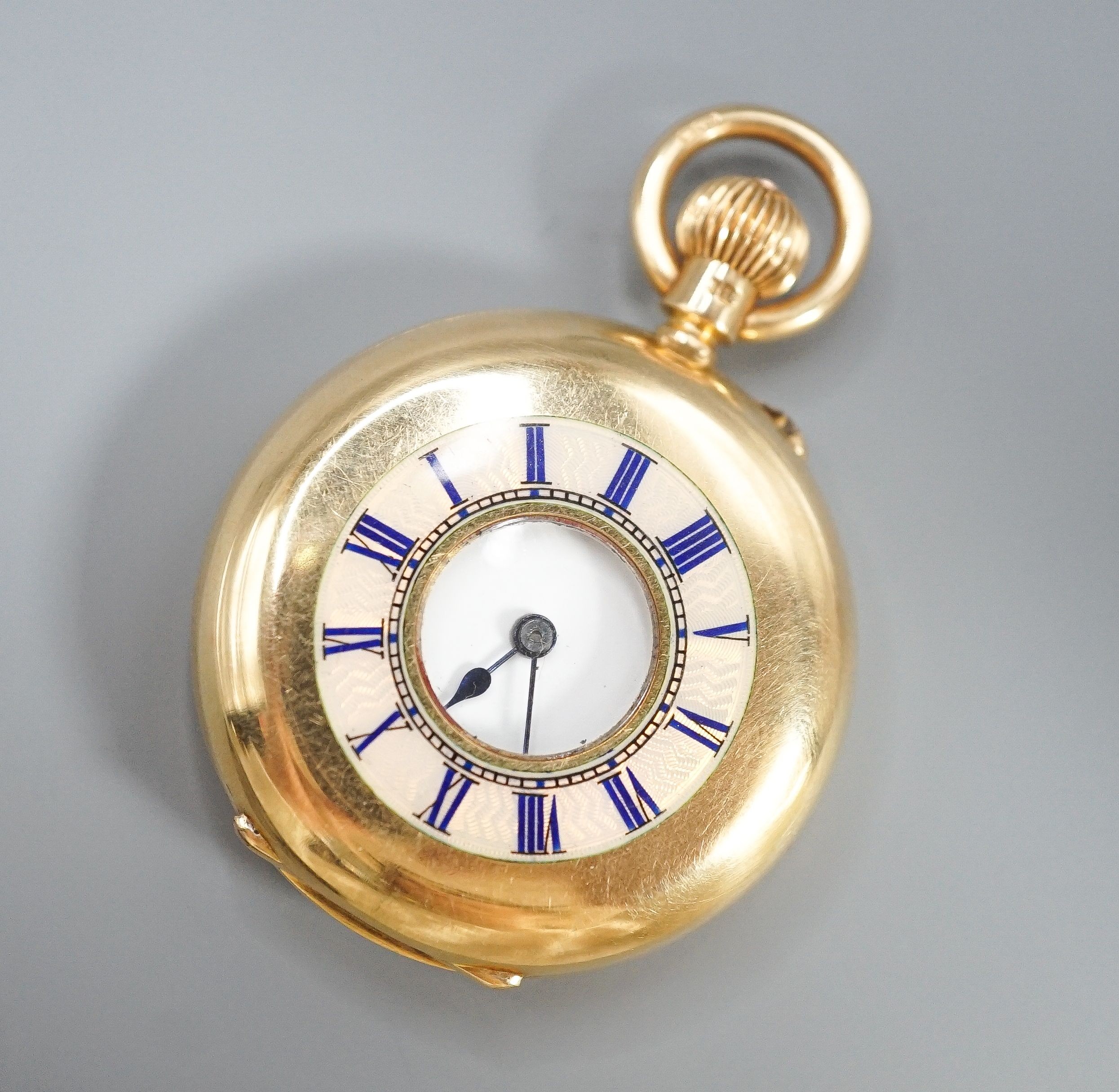 An Edwardian 18ct gold and guilloche enamel half hunter fob pocket watch, case diameter 35mm, gross 47.3 grams.